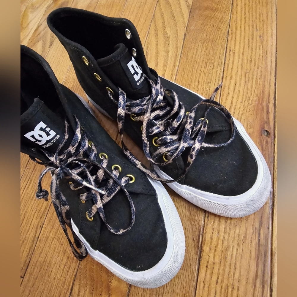 Black DC sneakers with cheetah print laces